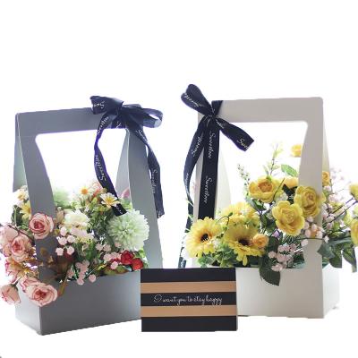 China Recycled Materials Wholesale Waterproof Flower Tote Basket Valentine's Day Mother's Day Wrapping Paper Flower Gift Box for sale