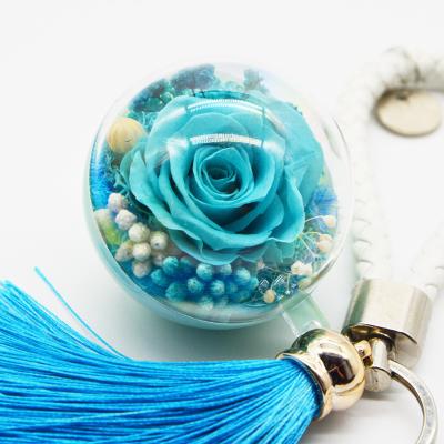 China Wholesale Creative Gift Ball Rose Bag Car Tassel Pendant Preserved Rose Flower Keychain for sale