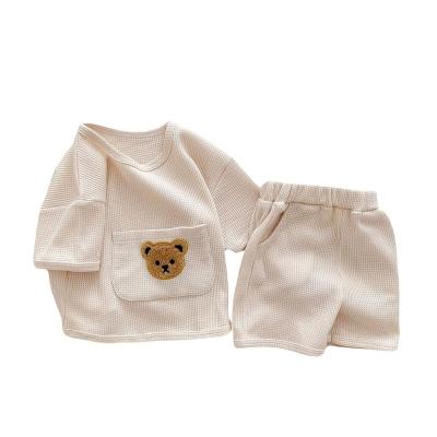 China Anti-Shrink Ins Style Baby Boys and Girls Set Baby Clothes Summer Two-piece Waffles Big Pocket Bear Top Shorts for sale