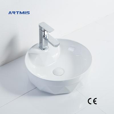 China Modern Hot Selling White Oval Wash Basin Art Ceramic Countertop Bathroom Modern Basin for sale