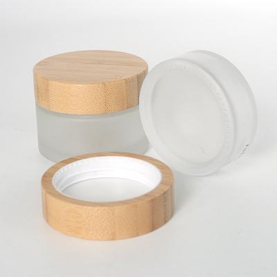 China Eco-Friendly Cosmetic Luxury Packaging Glass Jar With Bamboo Lid 15ml 30ml 50ml 100ml for sale