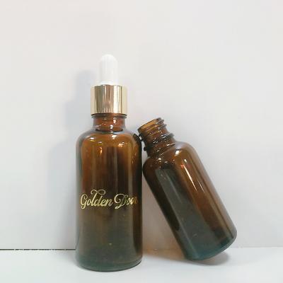 China Screen printing amber cosmetic glass frosted essential oil glass bottles with bamboo dropper and bamboo bottle pump for sale