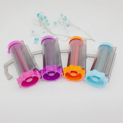 China Fashional Gift Promotion Toothpaste Dispenser Tube Rolling Plastic Squeezer for sale