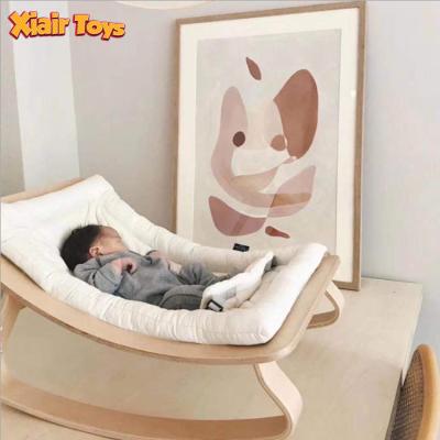 China Portable Foldable Baby Bouncer Xiair Montessori Baby Chair Comfortable Safety Cotton Bouncer Sofa Sleeping Bed Baby Cradle Wooden Rocker Chair for sale