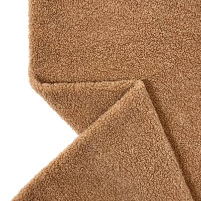 China Changshu City Baoyujia Stock Piel Coral Nios Tear-Resistant Fleece Teddy Fabric Durazno Para In Khaki Color for sale