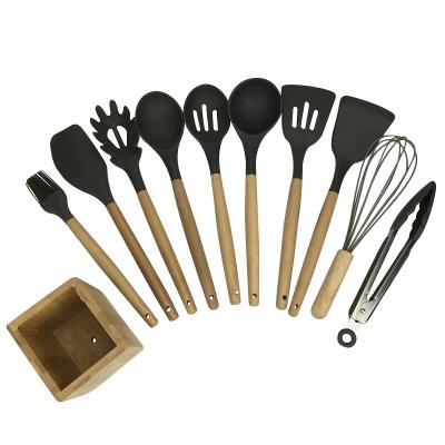 China Sustainable Kitchen Wooden Handle 11 Pcs Silicone Cookware Sets With Wooden Rack for sale