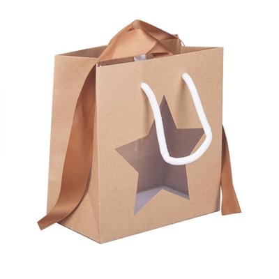 China Recyclable Kraft Window Paper Cake Customized Carrier Bag With PP Handle Ribbon for sale