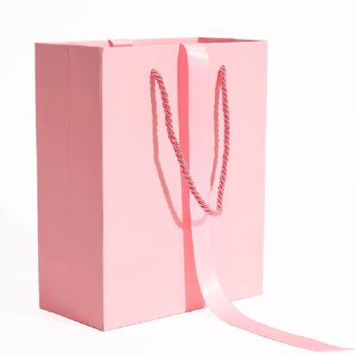 China Luxury Recyclable Christmas Gift Boutique Printed Paper Shopping Bag With Ribbon Handle Packaging for sale