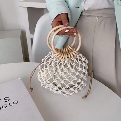 China Fashion Fashion Woven Hand Held Wrist Bags Simple Hollow Women Small Handbag for sale