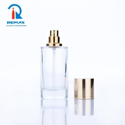 China Non Spill 50ml 100ml Empty Round Clear Glass Spray Perfume Bottle Cosmetic Glass Bottle With Spray And Magnetic Cap for sale