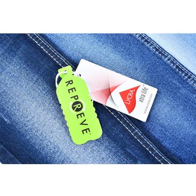 China Breathable repve eco-friendly denim fabric made from regular plastic bottles in rolls for jeans jacket spandex high fit for women wears for sale