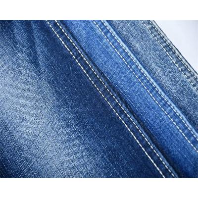 China Hot sale cheap jeans 10.2oz breathable with high stretch competitive fabric woven compact yarn jeans denim fabric textile for sale