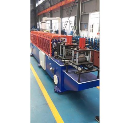 China Garage Door Track 1.5-2.0mm Galvanized Steel J Track Garage Door Roll Forming Machine With Oval Holes for sale