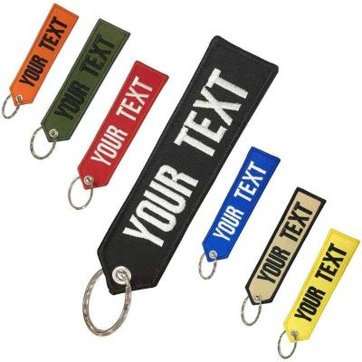 China Double Side Cheap Custom Label Embroidery Flying Fabric Woven Jet Embroidery Key Chain With Custom Logo for sale