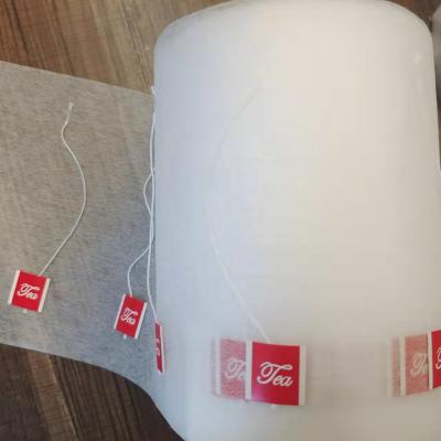 China Empty Food Package Heat Seal Non Woven Fabric Roll For Tea Packing With String And Label for sale