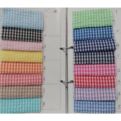 China 2021 Yard Dyed Organic Shirt Garment Cotton Seersucker Plaid Striped Fabric for sale