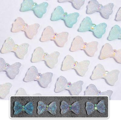 China 10 Pcs Symphony Nail Art Colorful 3D Resin Symphony Aurora Bow-knot Nail Decoration for sale