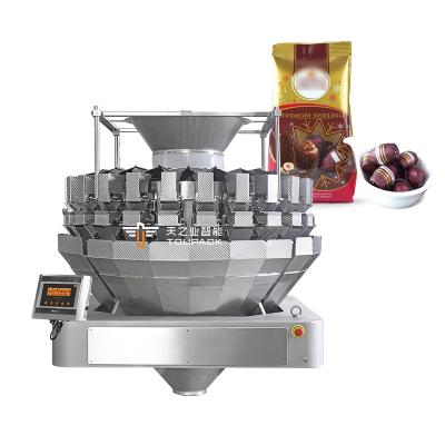 China Máquina automática de enchimento de embalagens de chocolate misturado com tampa e rotulagem de linha de embalagem de snacks de nozes à venda