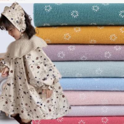 Cina Printed Flannel Cotton Shirt Fabric Spandex Brush Kids Skirt Autumn Dress Fabric  55SX50S 120GSM in vendita