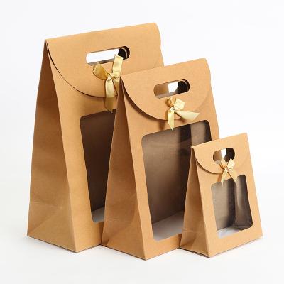 China Recycled Materials Kraft Paper Shopping Gift Bag Brown Cupcake Packaging Box Bag With Clear PVC Window Bolsa De Papel Triangle Eco-Friendly for sale