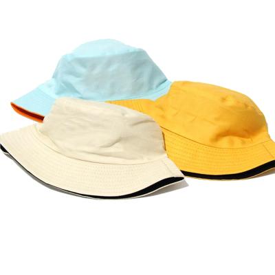 China Custom Wholesale Image Mens And Womens Reversible Double Sides Dual Bucket Hats for sale