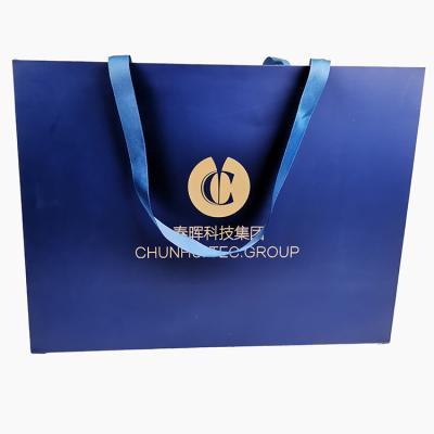 China Free Sample Recyclable Custom Branded Navy Blue Gold Gift Kraft Paper Bag for sale