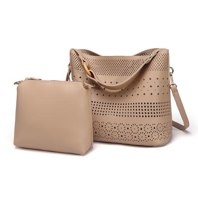 China 2021 new fashion tassel cross - body shoulder bag small fresh hollow bucket female portable handbag retro for sale