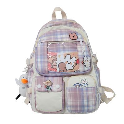 China Wholesale New Plaid College Style Large Capacity Summer Girl Bag Soft Cartoon Anti-theft Schoolbag Increasing School Travel Plaid Backpack for sale