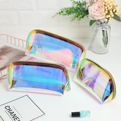 China New Laser Fashion Glitter Tpu Color Skin Care Travel Clear Holographic Transparent Female Portable Magic Makeup Cosmetic Bag Toiletry Bag for sale