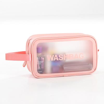 China 2021 Fashion Pink Medium Transparent PVC Makeup Travel Toiletries Makeup Wash Cosmetic Bag for sale