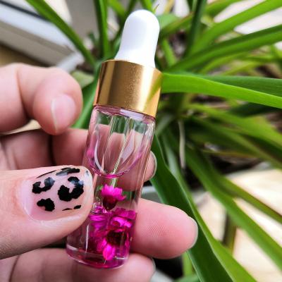 China Daily Nail Care 10ML Flower Scented Nail Nourishing Revitalizing Liquid Cuticle Oil With Dry Flowers for sale