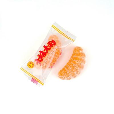 China Natural Chinese Popular Classical Sugar Coated Gummy Candy Orange Shape Person Packing Soft Candy for sale