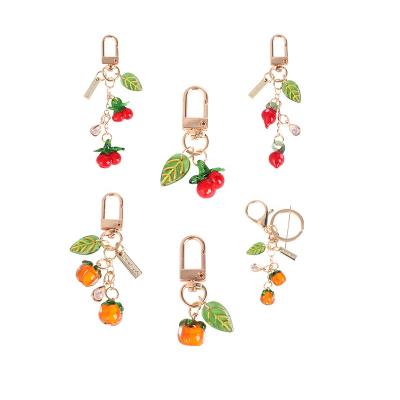 China Wholesale Qingqi Daily Life Metal Fruits Gold Plating Pendant Key Chains With Cherry Christmas Birthday Gifts For Kids For Best Friends for sale