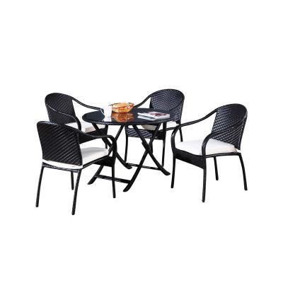 China JIAHE 5pcs outdoor furniture set tempered glass rattan round dining table contemporary foldable waterproof black garden chairs for sale