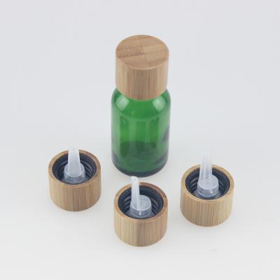 China 18/415 cosmetic wholesale bamboo screw cap for 5ml 10ml 15ml 20ml 30ml 50ml 100ml essential oil glass green bottle for sale