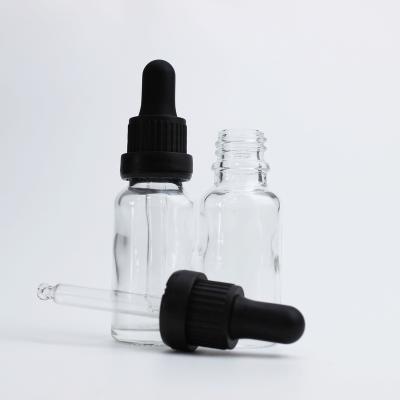 China Clear 30ml Essential Oil Cosmetic Glass Dropper Bottle With 18/415 Tamper Evident Dropper Cap for sale