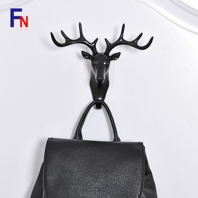 China Plastic Deer Hook Minimalist Creative Adhesive Head Wall Hook Personality Decoration Wall Antlers Wall Hook for sale