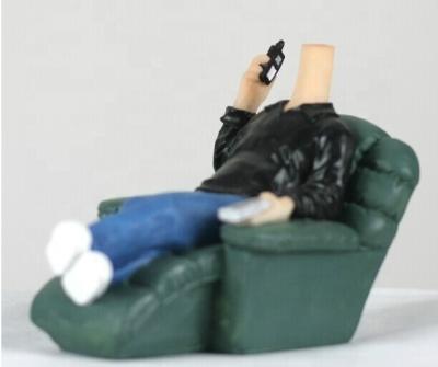 China U.S.A Man Sitting on Sofa Shaking Main Body of Statue Crafts for sale