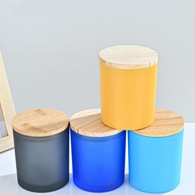 China Wholesale Home Decoration Empty Glass Candle Jar With Wooden Lid Amber Black Empty Glass Candle Colorful Frosted Jar With Lid Bamboo Box for sale