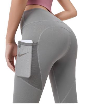 China Breathable Yoga Clothes Stretch Tight High Waist Mesh Side Pockets Yoga Tight Running Yoga Pants Waist Gaiters for sale