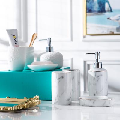 China Sustainable White and Marn 4 Piece Ceramic Bathroom Set with Soap Dispenser, Toothbrush Holder, Tumbler and Soap Dish for sale