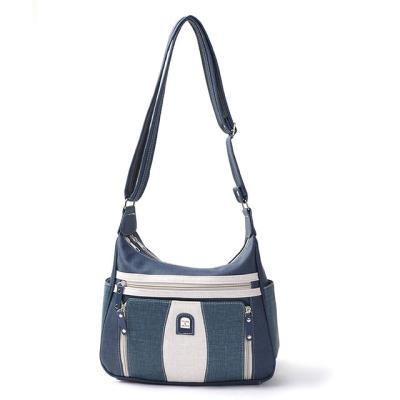 China Retro Niche OEM Classic Denim Custom Made Leather Design Blue Women Shoulder Messenger Bag Fashion Casual Fashionable Semi Armpit Bag for sale