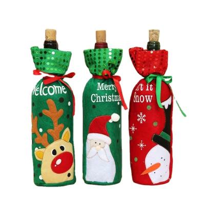 China 2022 Newest Felt Red Color Christmas Wine Bags Stand Up Drawstring Gift Bag Christmas Party Bags for sale