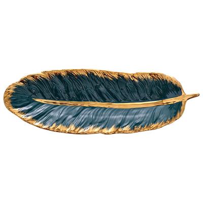 China Creative Nordic Feather Viable Light Luxury Gold Edge Style Snack Dish Dessert Dish Leaf Jewelry Storage Ceramic Gold Dish for sale