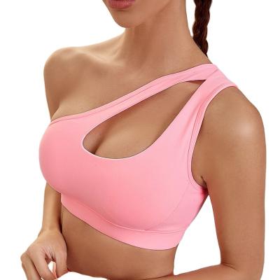 China 2022 New One-Shoulder Sports Yoga Bra Fitness Shockproof Quick Dry Current Padded Nude Bra Antibacterial Cavity Vest Shockproof for sale