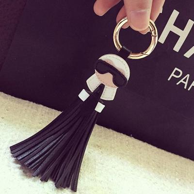 China Cute Promotional Gifts Women BagTassels Bag Charm Holder Ornaments Leather Key Chain for sale