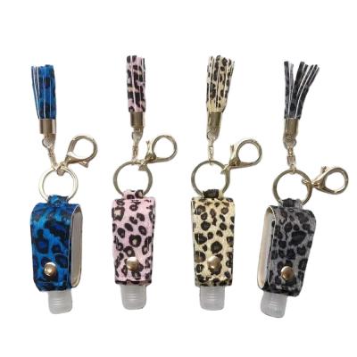 China Leather Bottle Tassel Sanitizer Promotion Gift Travel Bottle Leopard Hand Key Chain for sale