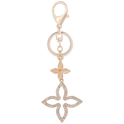 China Creative Fashion Clover Promotion Gift Gold Key Holder Metal Key Chain Key Chain for sale