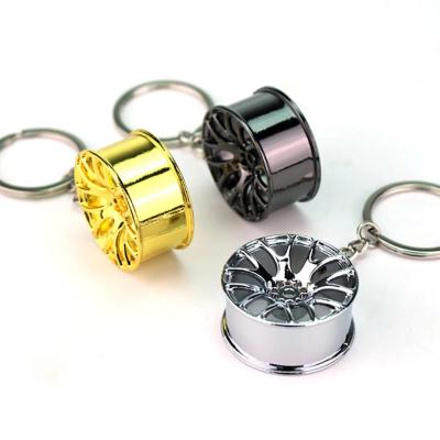 China Promotional Gifts Shape Metal Wagon Wheel Key Chain Ring Stylish Car Keychain for sale