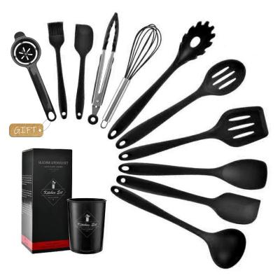 China Food Grade Process Stocked Black One Piece Molding Silicone Cooking Kitchen Utensil Set Rack Accessories Spatula Turner Cookware for sale